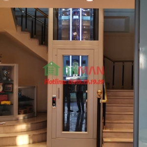 Mẫu thang máy cửa mở tay